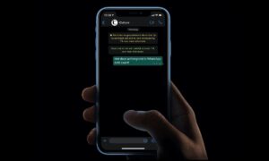 How to adjust the brightness of chat wallpaper in WhatsApp